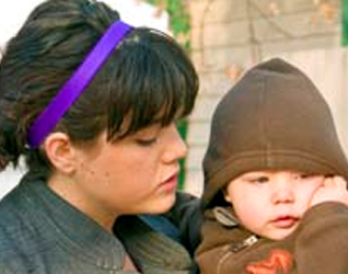 Kim Bombak and her baby were among those who came to pray for life Oct. 8 across from the Morgentaler clinic.