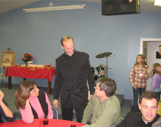 Fr. Daniel Brandenburg LC visits with families during the “Christ the King” Day celebration