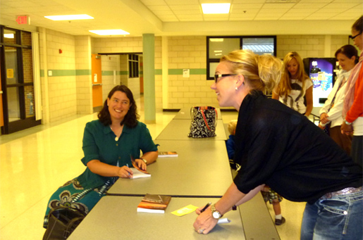 Joan talks with mothers at a book signing at Everest Academy in Clarkston, Michigan