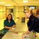 Joan talks with mothers at a book signing at Everest Academy in Clarkston, Michigan