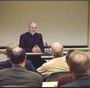 Fr Anthony Bannon, LC giving a talk to businessmen.