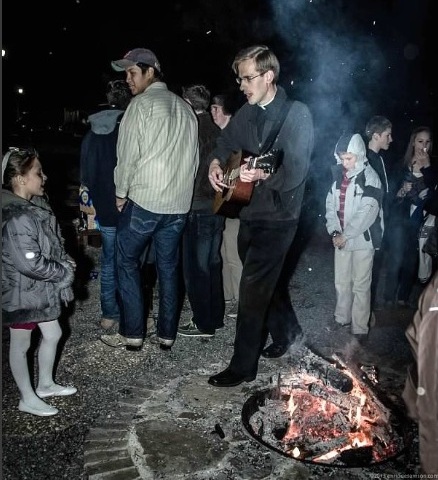 Br. John Klein LC sings at bonfire in Atlanta.