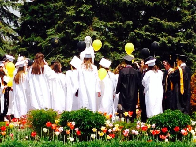 EC Graduates saying the rosary