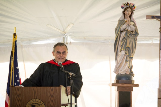 Fr. Gomez speaking at Everest graduation