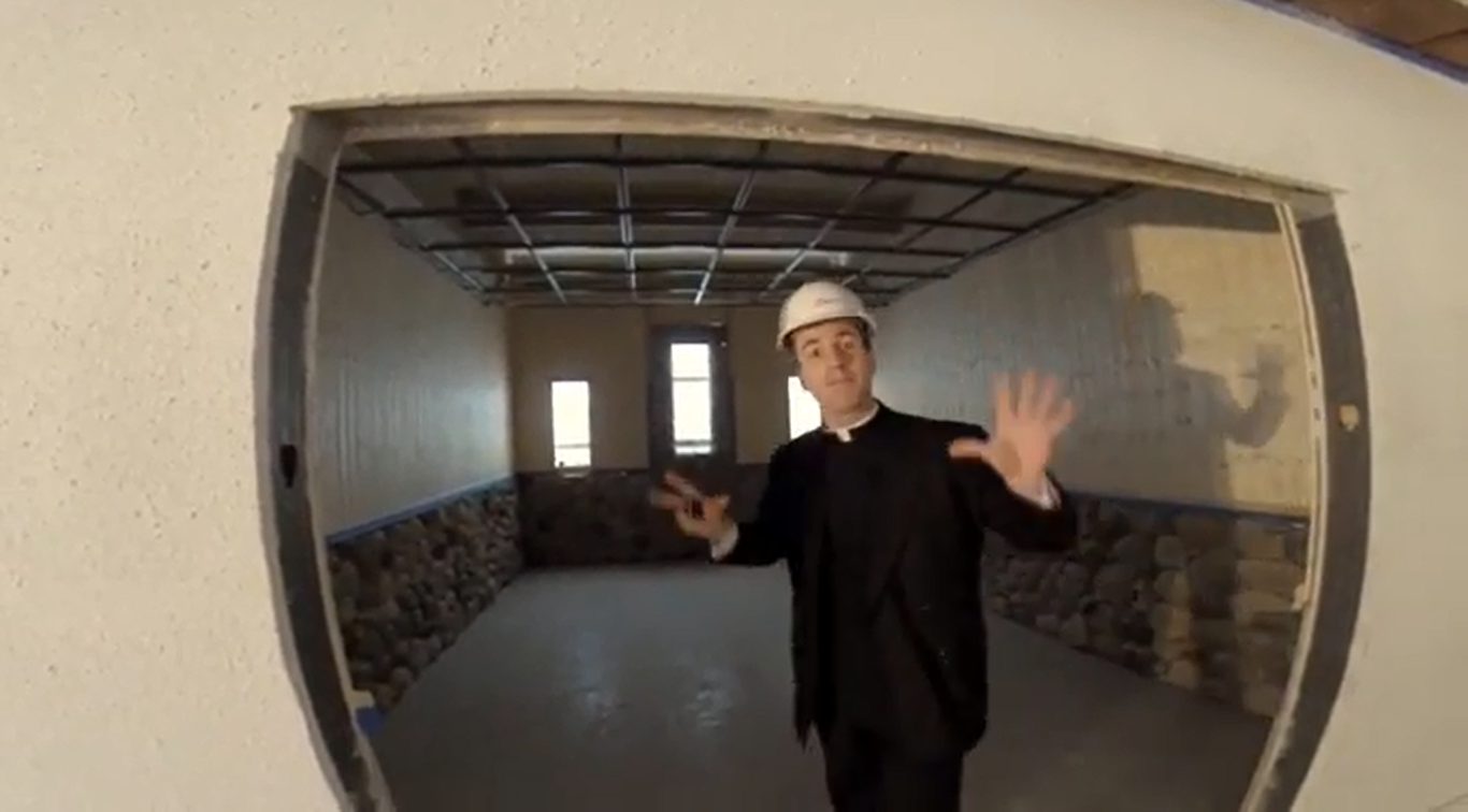 Fr. Gregory Usselmann shows off The House chapel