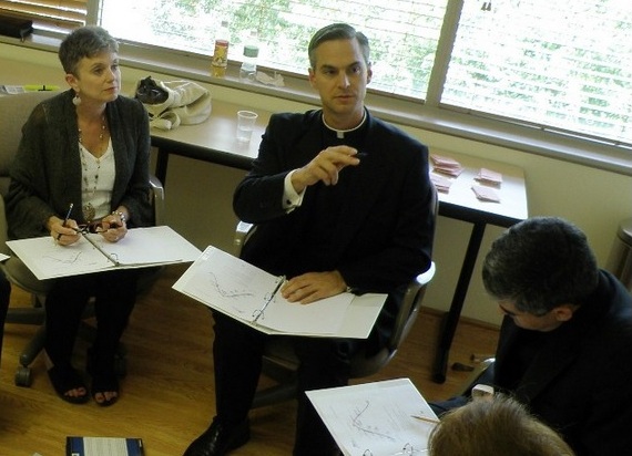 Fr. John Bartunek directing a small group.