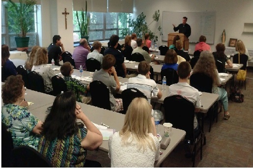 Fr. Jason Mitchell talks with teens