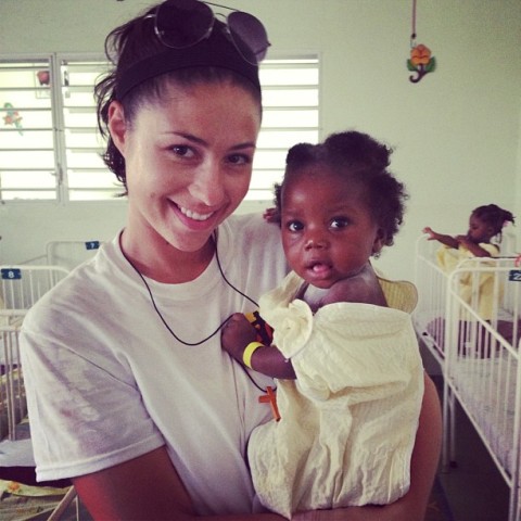 Chelsea Gheesling with a Haitian child