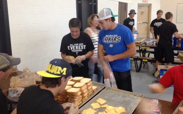EC Football team makes sandwiches for the homeless