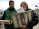 This picture of Pilar Bulnes giving out a Pilgrim Queen triptych first appeared in the online newspaper mural.com.