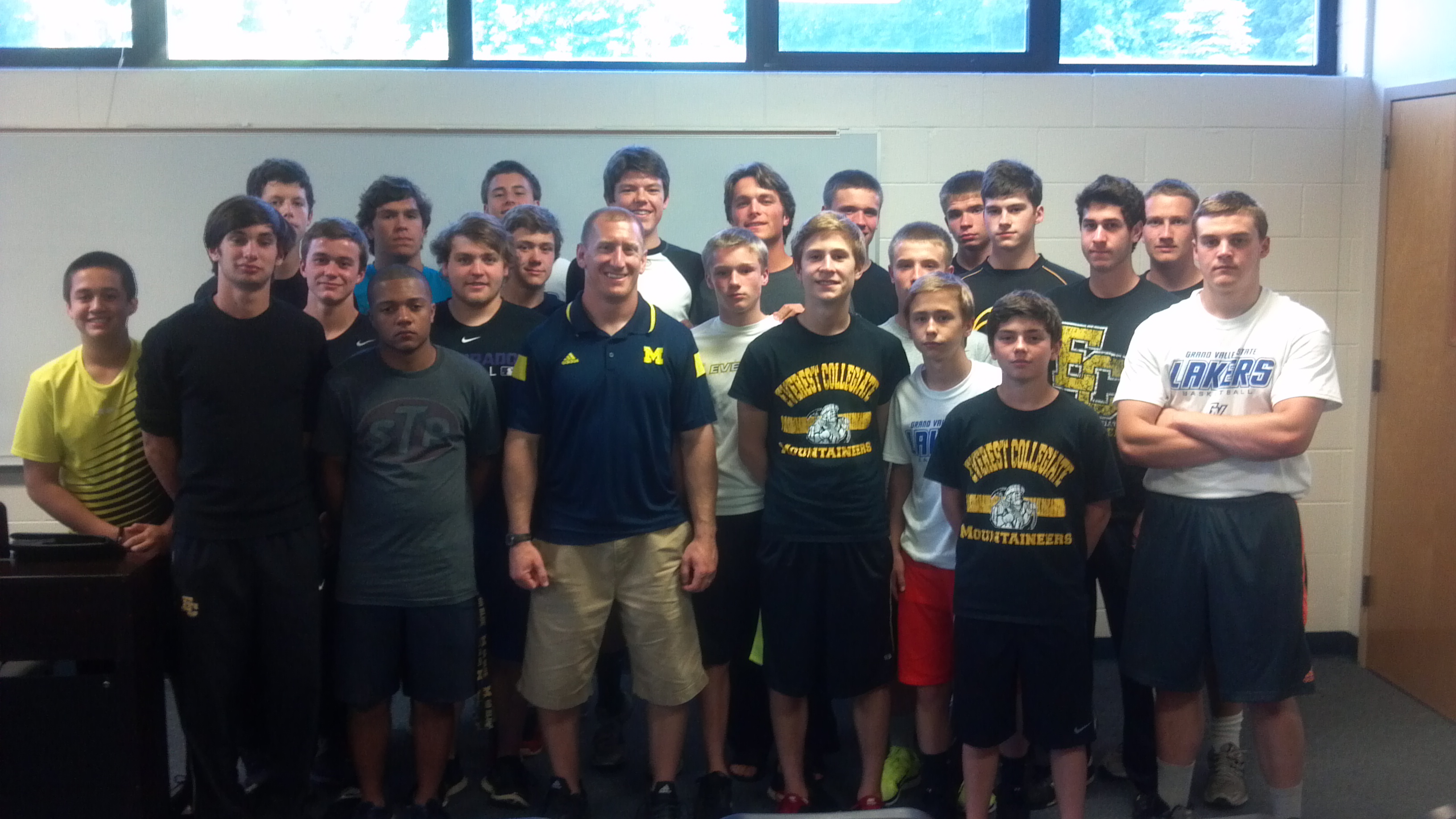 EC football team with U of M speaker Lewis Caralla