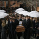 Youth from the Cumbres School of Santiago de Chile carry the coffins of the girls who died in the tragic accident.