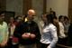 Tom Naemi talks with April Pickett before the healing service