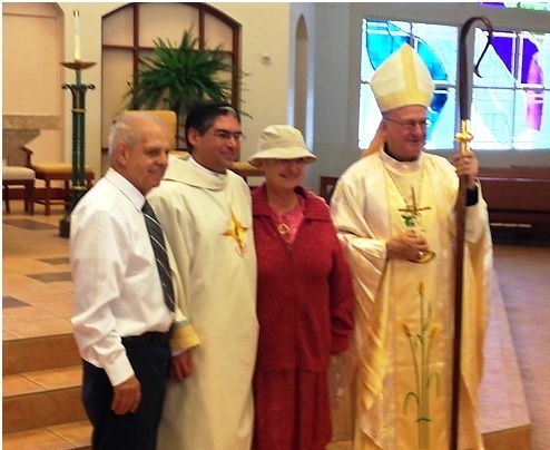 Deacon Joseph Poulin LC with his father and mother and the Bishop.