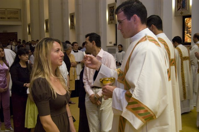 Fr. Thomas gives Communion to his sister-in-law on the day of his ordination to the diaconate, June 30, 2009.