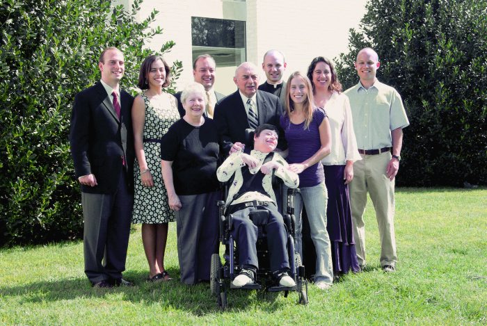 Fr. Thomas with his parents and his three brothers and four sisters in a family reunion.