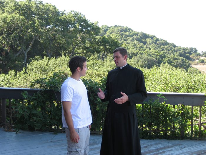 Fr. Joshua gives spiritual guidance as part of his youth work.